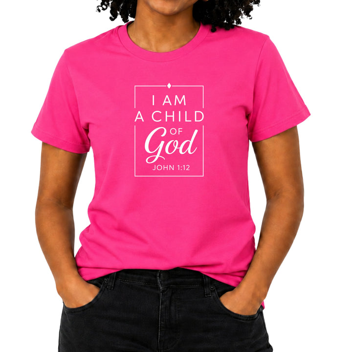 Pink t-shirt with "I am a child of God, John 1:12" in white text.